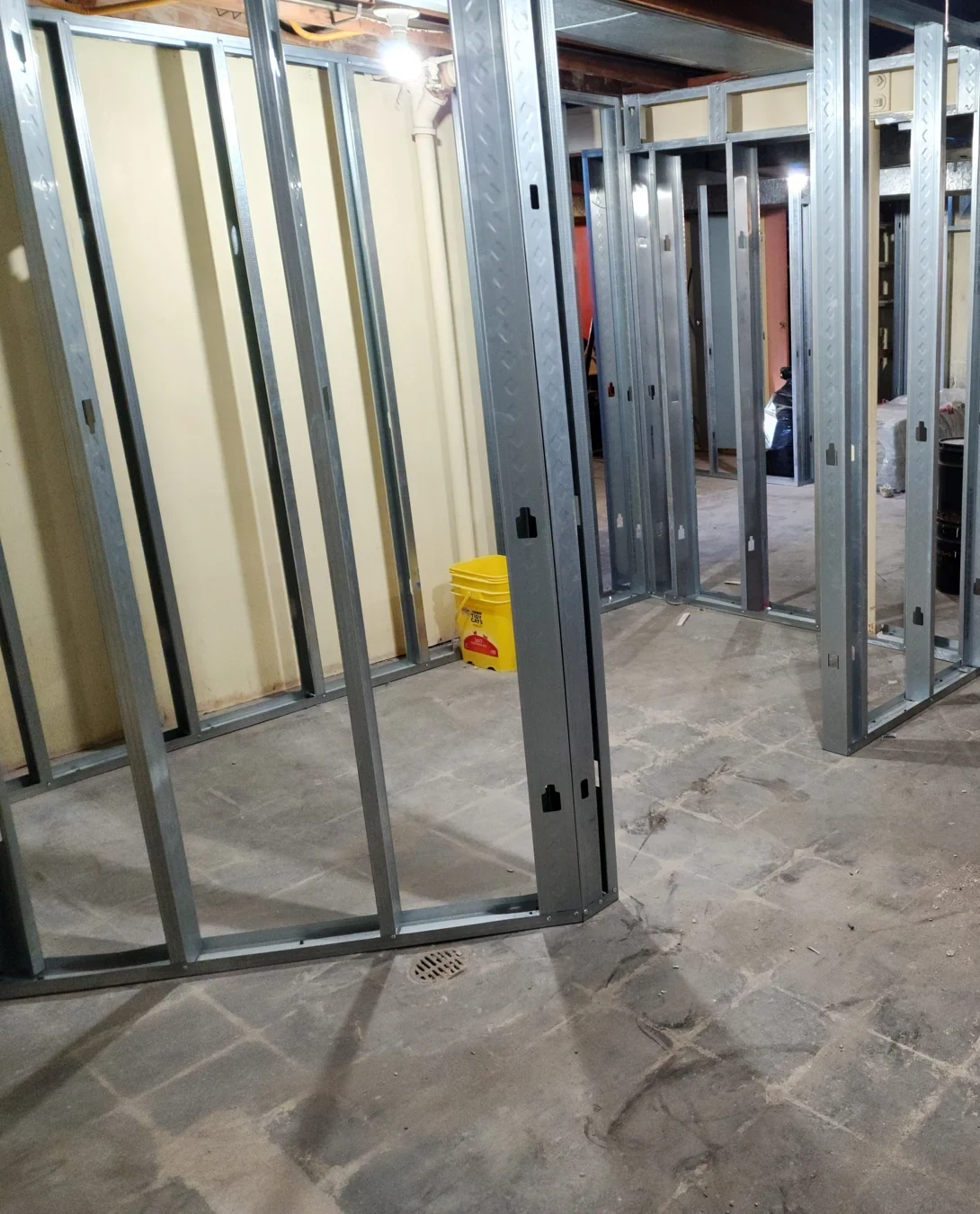 February 2023 basement framing progress. The wall layout is visible before enclosure.