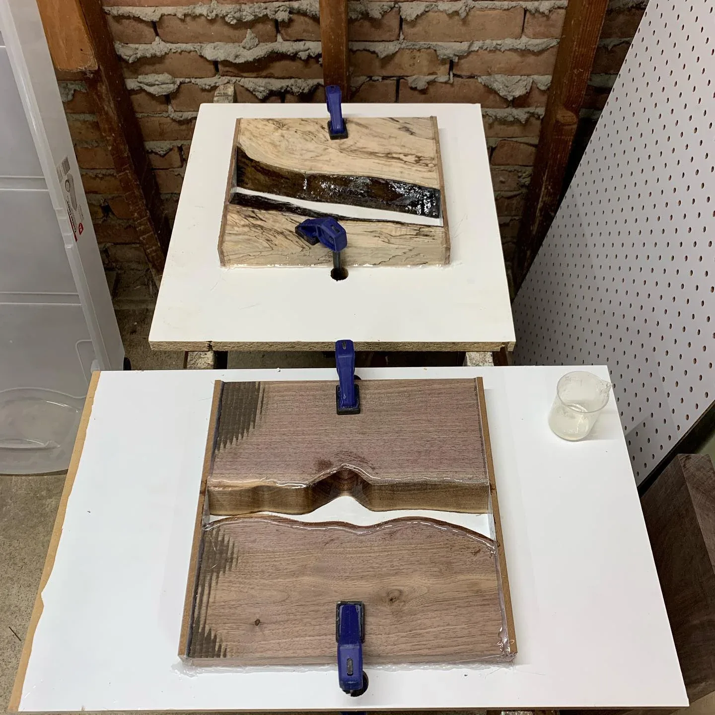 The two July tabletops in their rectangular pouring forms before being cut round.