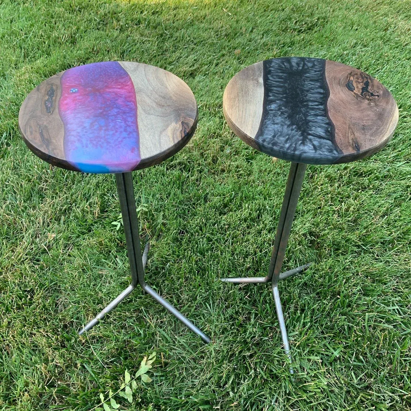 Two June 2020 resin martini tables, one iridescent and one dark.