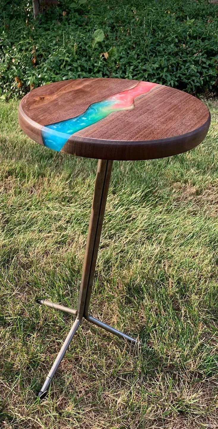 Multicolor-resin and walnut table; crop of the original two-table photograph.