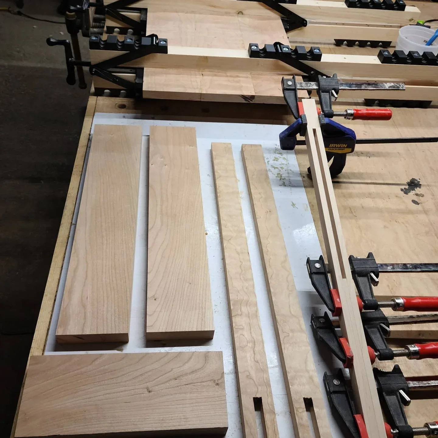 Cherry components and clamped parts during fabrication.