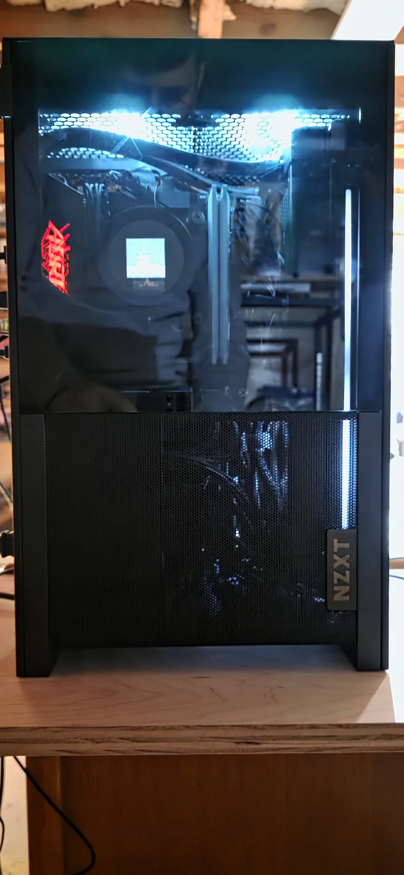 The 2026 compact PC assembled in its black NZXT enclosure, with the side panel fitted.
