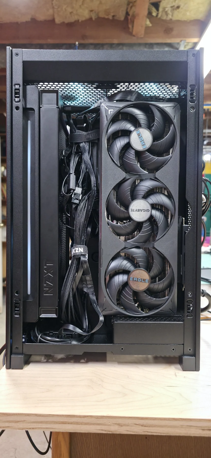 The opposite side of the compact PC with the Gigabyte Eagle graphics card installed vertically.