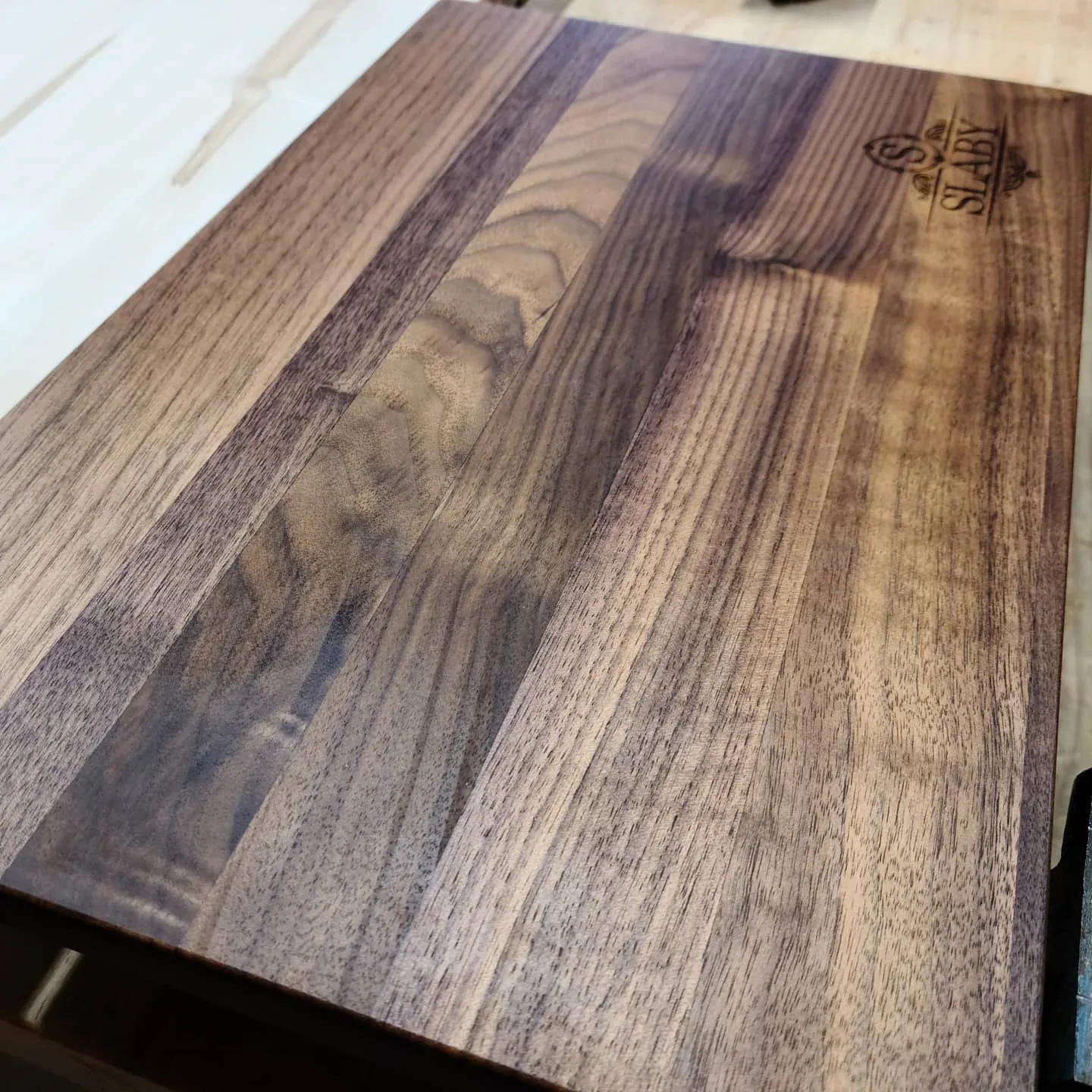 A customer-owned striped cutting board after refinishing.