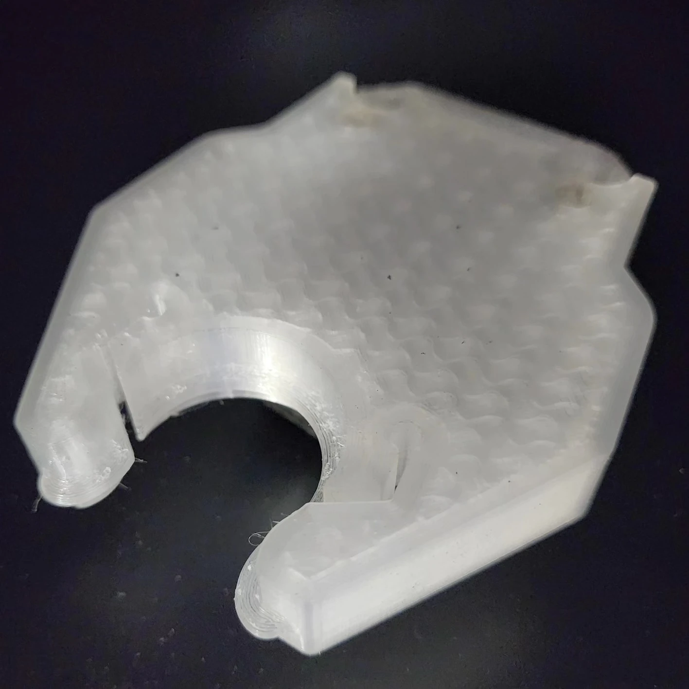 Close view of the curved tool-retention opening and printed detail of the TPU replacement.