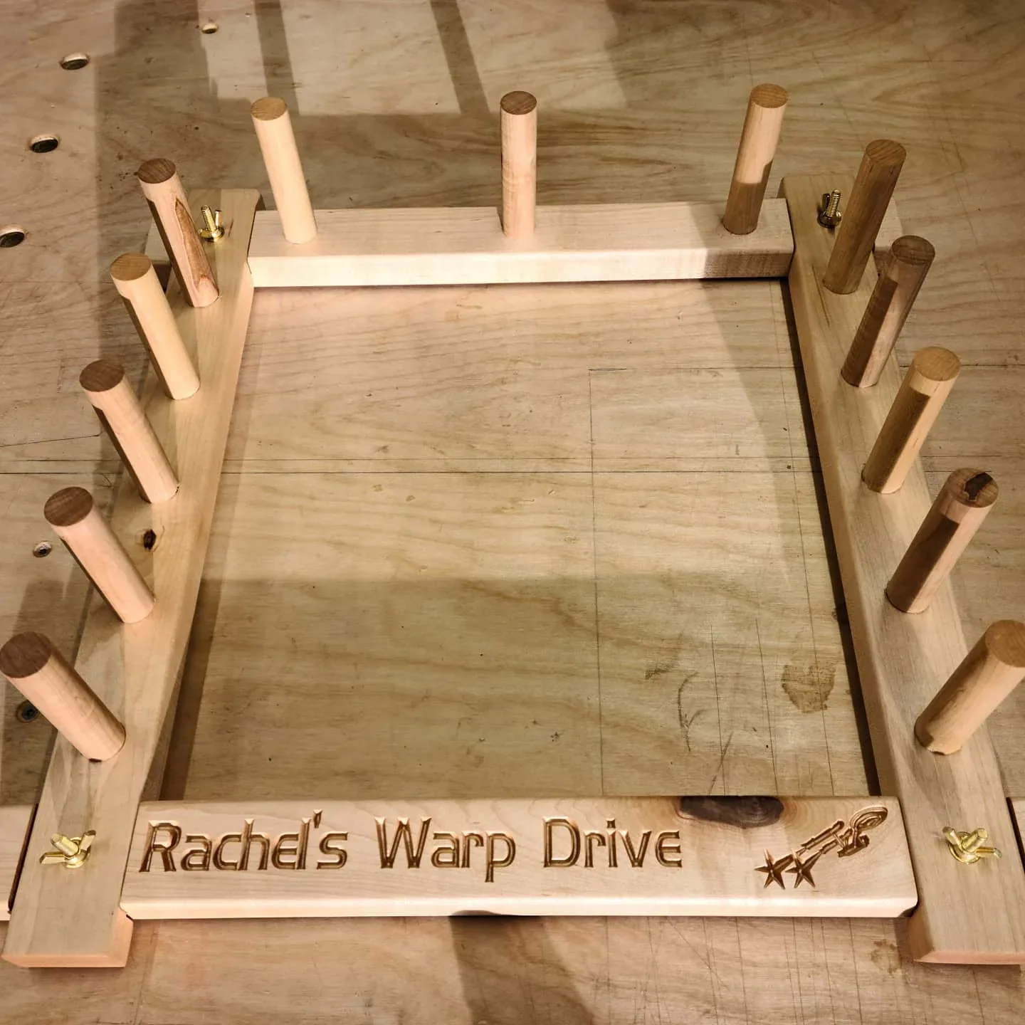 Cherry warping board with wooden pegs and a Star Trek-inspired inscription.